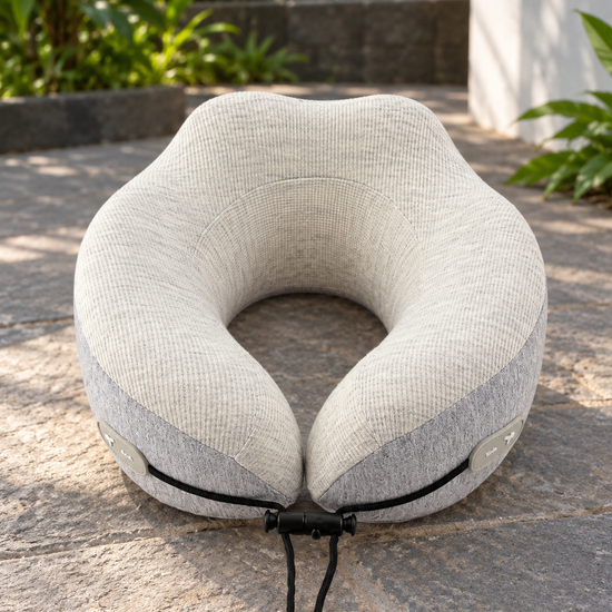 T&CO dual-tone oatmeal cream and heather grey ergonomic memory foam travel neck pillow with toggle drawstring closure