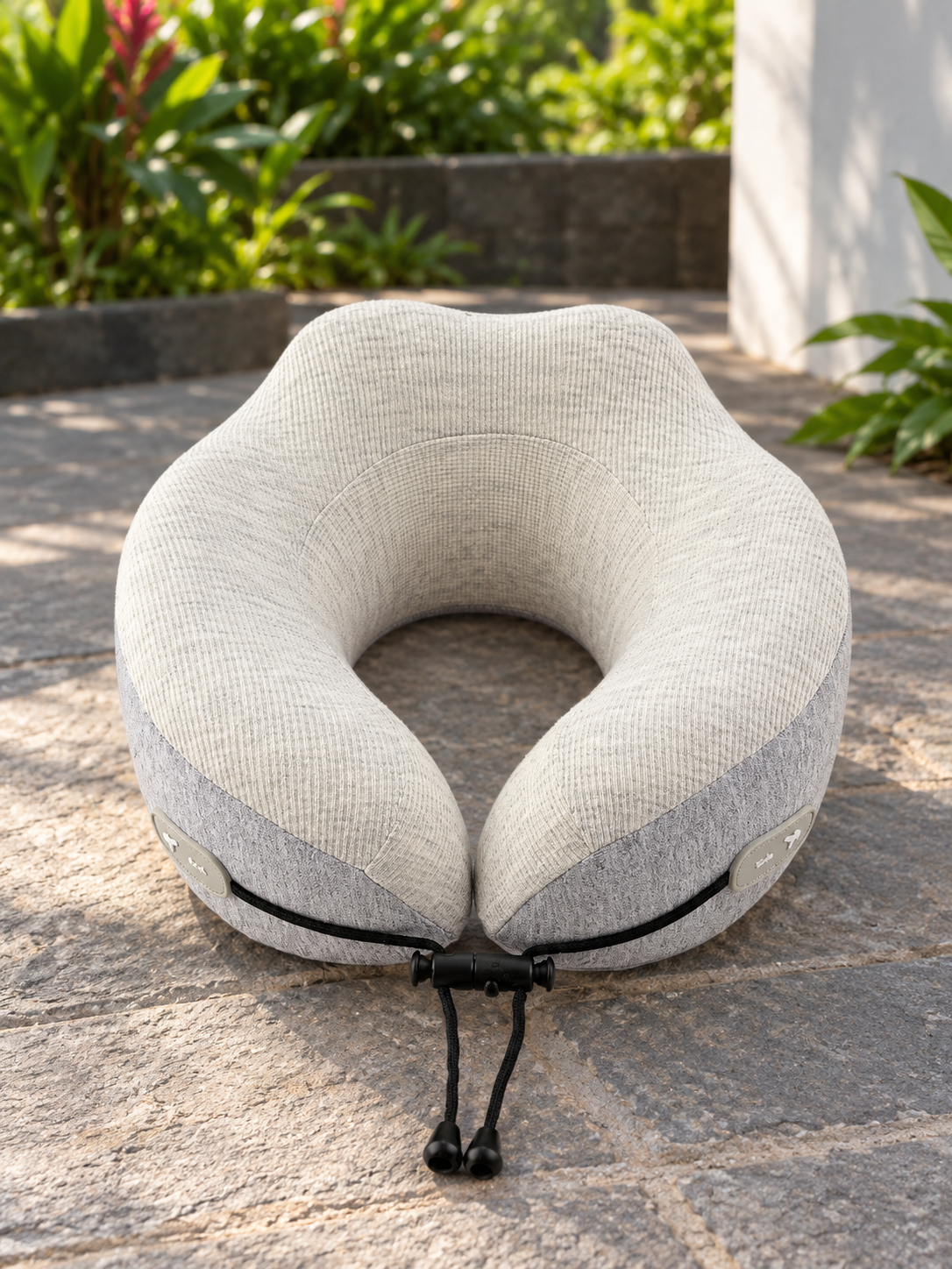 T&CO dual-tone oatmeal cream and heather grey ergonomic memory foam travel neck pillow with toggle drawstring closure