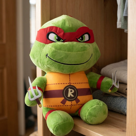 T&CO TMNT Ninja Turtle Raphael plush toy with red eye mask, 'R' belt buckle, and twin sai daggers (31cm)
