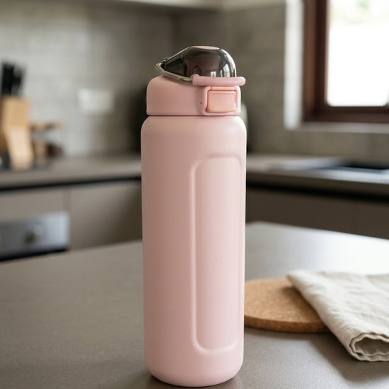 Safety flip-lock insulated stainless steel water bottle in pastel blush pink with one-touch push-button flip lid