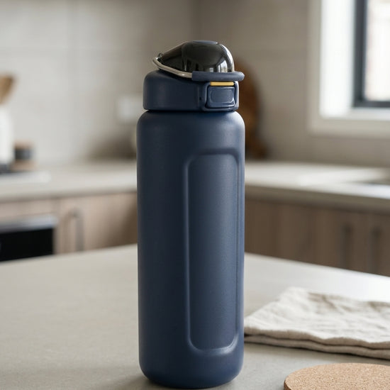 Safety flip-lock insulated stainless steel water bottle in deep navy blue with one-touch push-button flip lid