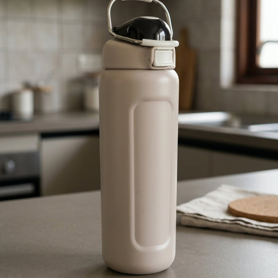 Safety flip-lock insulated stainless steel water bottle in warm oat beige with one-touch push-button flip lid