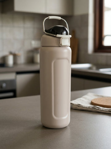 Safety flip-lock insulated stainless steel water bottle in warm oat beige with one-touch push-button flip lid