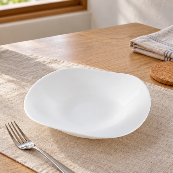 T&CO modern white tempered opal glass square serving bowl with curved organic wave rim on dining table runner beside fork