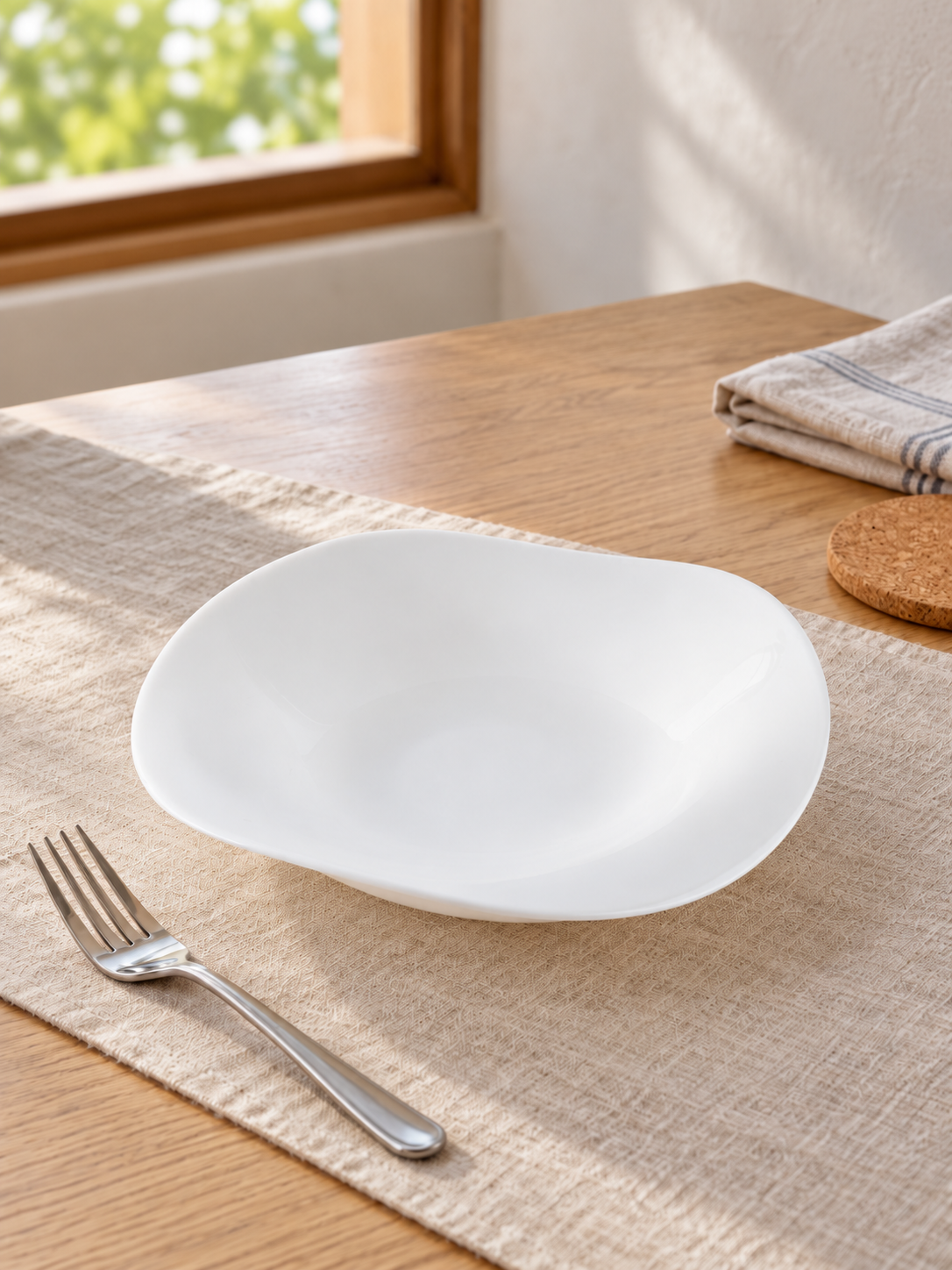 T&CO modern white tempered opal glass square serving bowl with curved organic wave rim on dining table runner beside fork