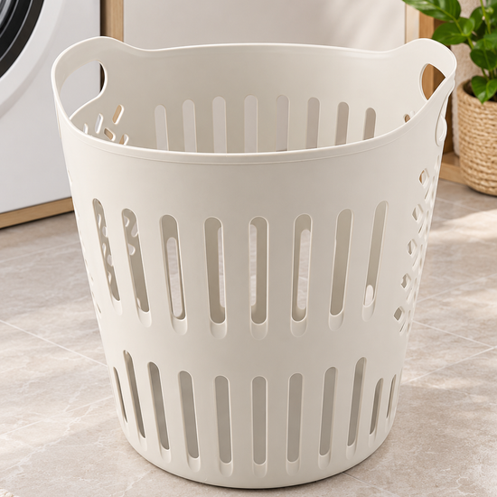T&CO round ventilated plastic laundry basket and clothes hamper in warm cream with dual ergonomic handles and vertical airflow cutouts
