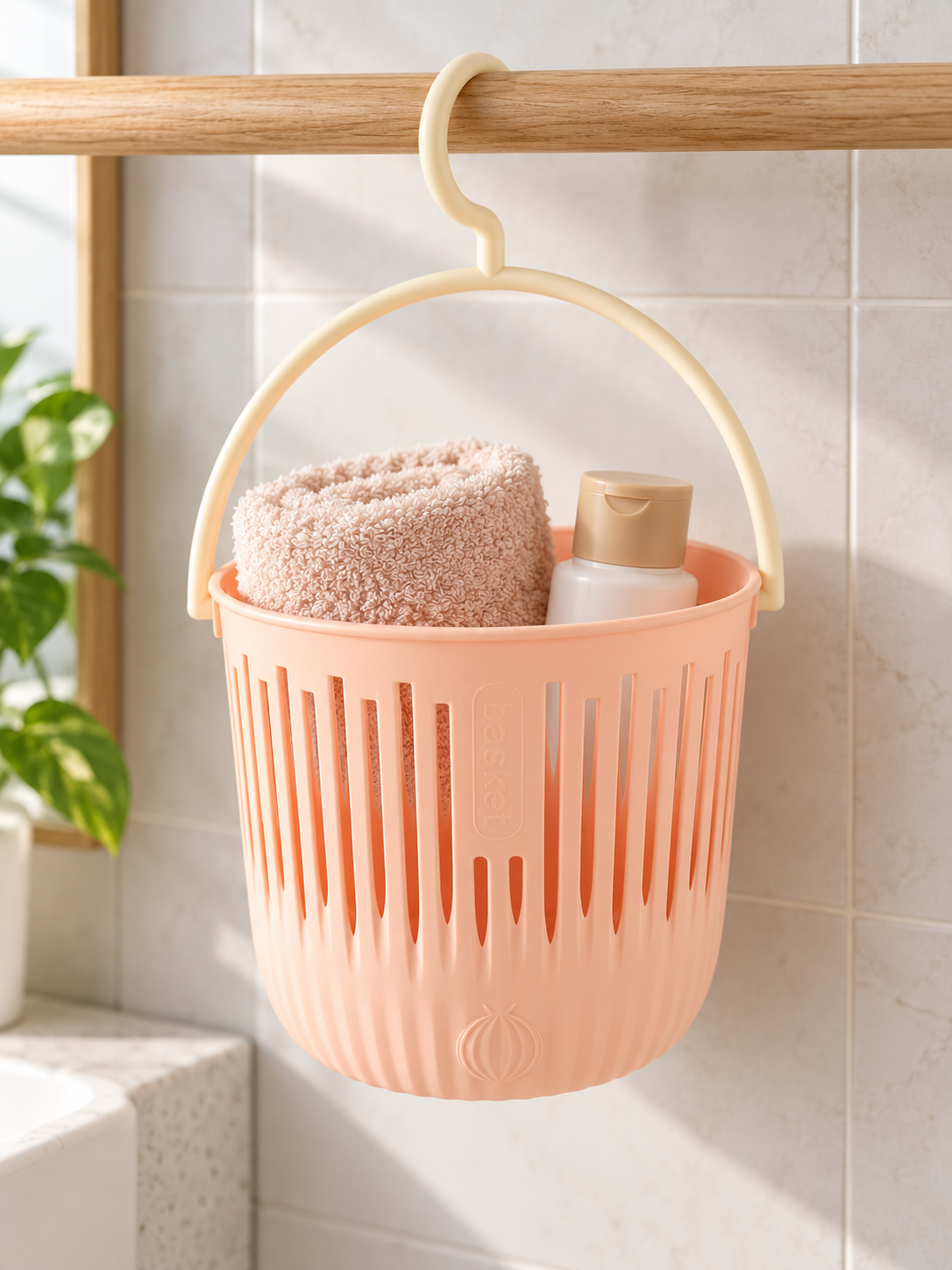 T&CO pastel pink ventilated hanging shower and storage basket with swivel hook holding toiletries 16cm