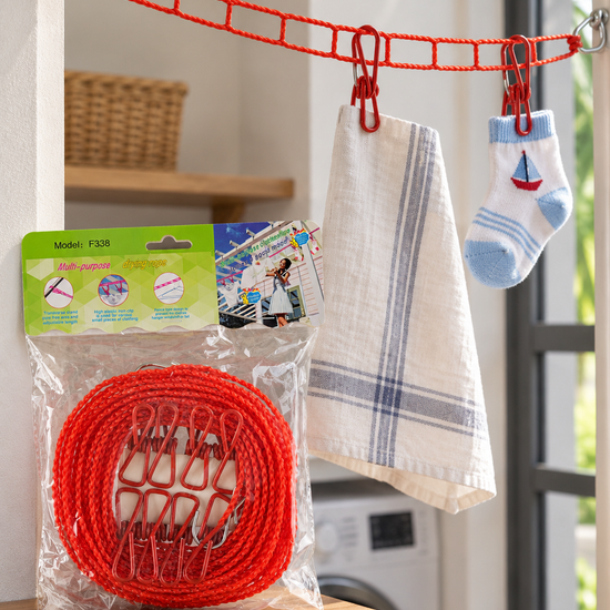 T&CO windproof portable clothesline drying rope in bright red with 12 coated metal clothespins and dual steel hooks