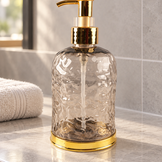T&CO luxury water-ripple textured glass liquid soap dispenser in smoke grey with polished gold pump and base ring