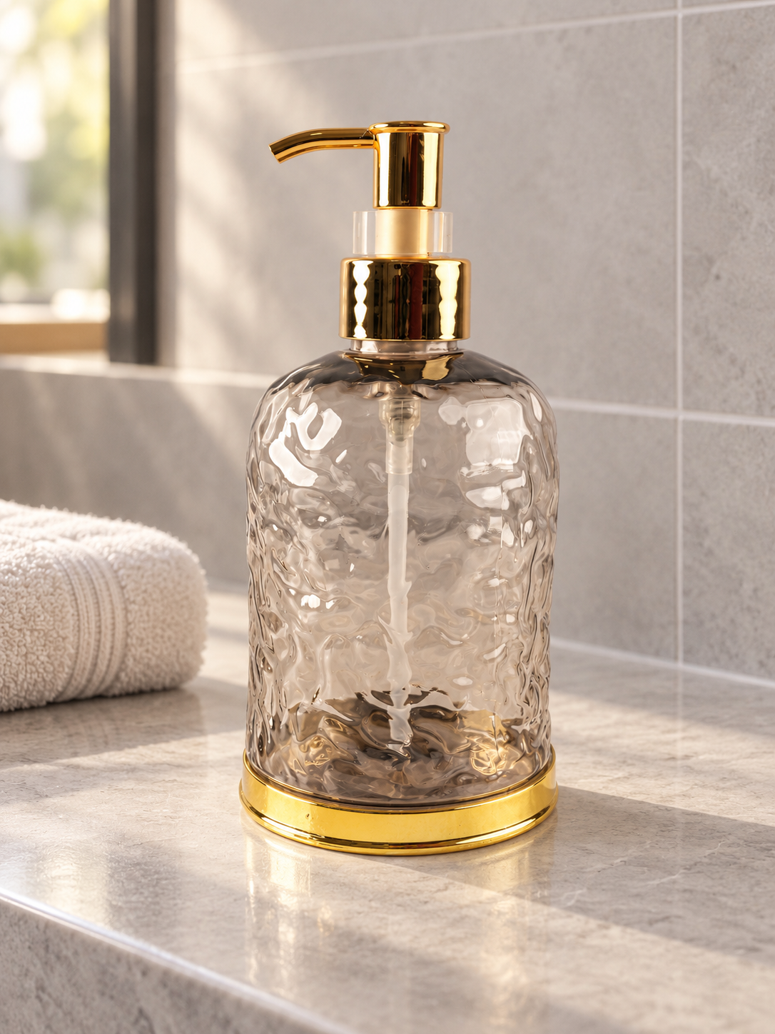 T&CO luxury water-ripple textured glass liquid soap dispenser in smoke grey with polished gold pump and base ring