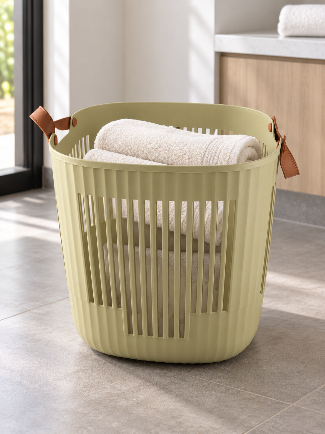 T & CO olive green fluted laundry basket with brown faux leather handles (38 x 38 x 39 cm)