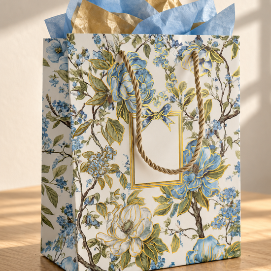 Thilakma small blue floral botanical gift bag with gold cord handles and blue tissue paper