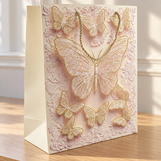 Medium blush pink grand butterfly wing lace gift bag with gold cord handles