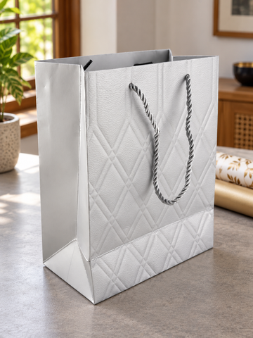 Small silver quilted diamond metallic gift bag with twisted silver rope handles