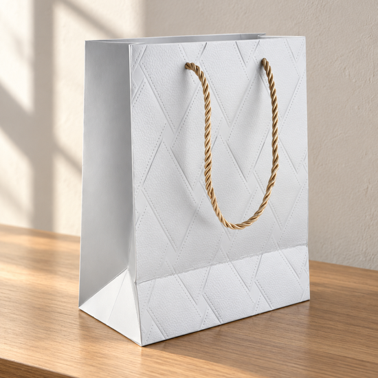 Small silver basket weave texture metallic gift bag with matching silver rope handles