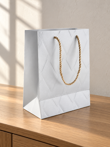 Small silver basket weave texture metallic gift bag with matching silver rope handles