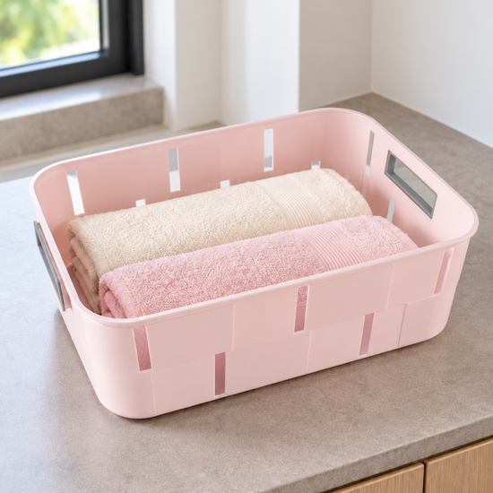 Pastel pink plastic storage tub basket with cutout side handles for home organization