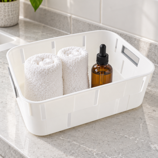 Classic white plastic storage tub basket with cutout side handles for shelf organization