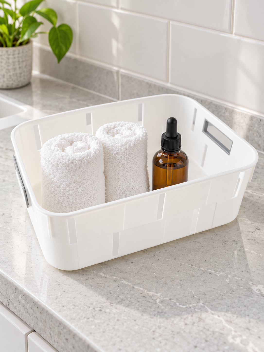 Classic white plastic storage tub basket with cutout side handles for shelf organization