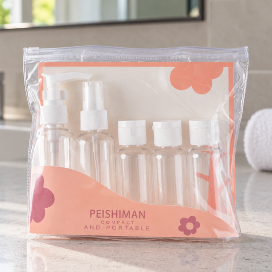 White portable travel toiletry bottle set in a clear waterproof zipper pouch