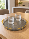 Large round plastic serving platter with deep protective rim angled view
