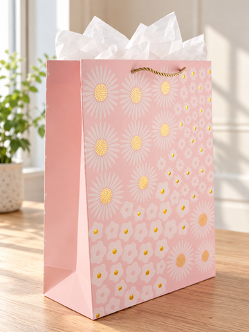 Golden Daisy Bloom large blush peach paper gift bag featuring white daisy blossoms with radiant gold foil stamped centers and twisted gold rope handles