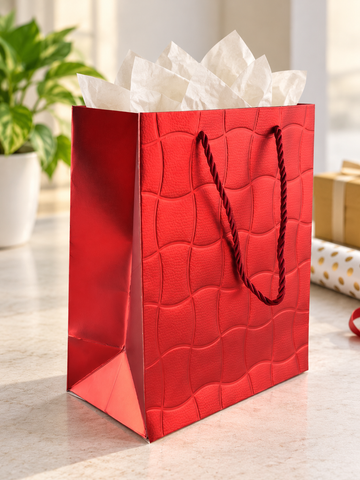 Embossed Ripple Wave small paper gift bag in textured metallic crimson red with undulating wave grid pattern and twisted red rope handles