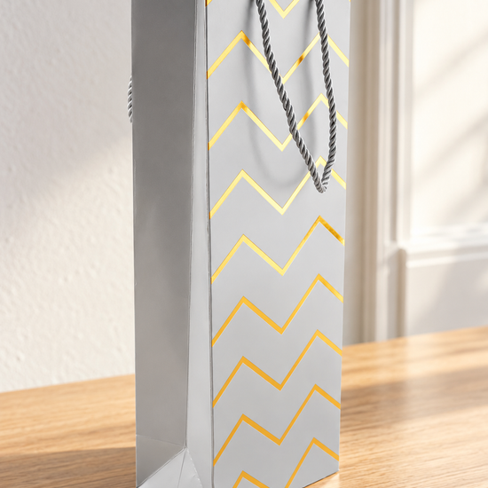 Silver metallic chevron zigzag foil single wine bottle gift bag measuring 13 by 8.5 by 36 cm with rope handles