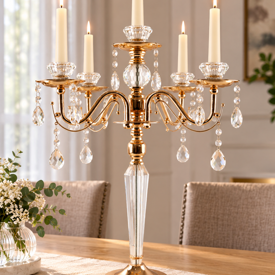 Magnificent 5-arm polished gold candelabra centerpiece featuring faceted crystal stem and cascading crystal teardrop pendants
