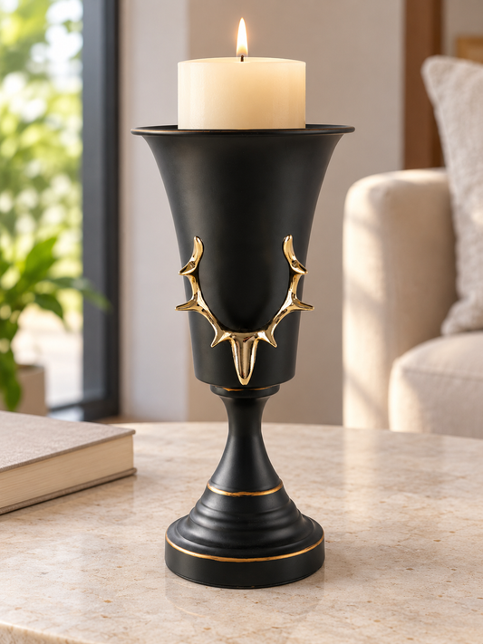 Matte black urn chalice pedestal pillar candle holder featuring an embossed gold stag antler crest and gilded rim