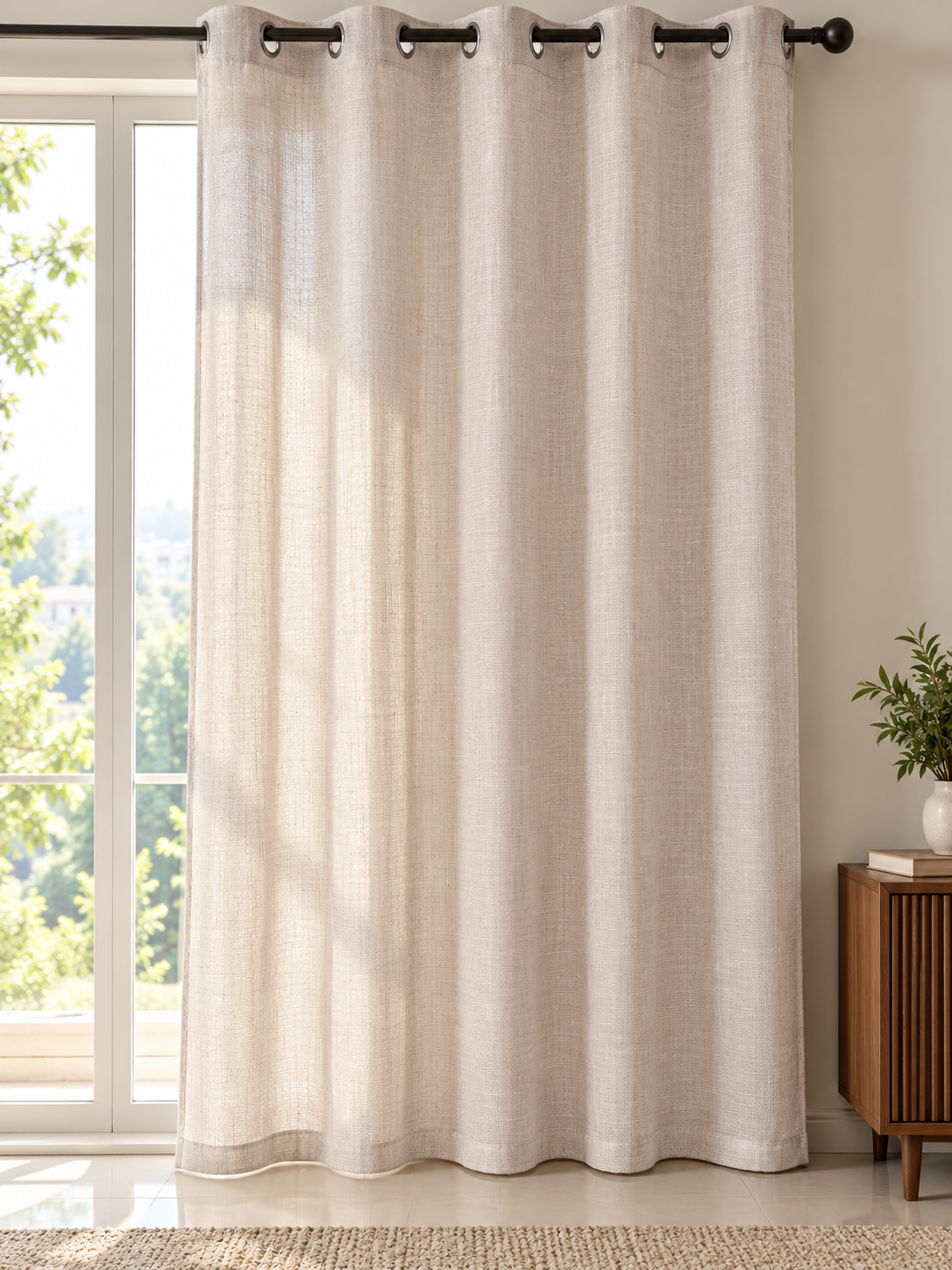 Soft cream slub linen look sheer eyelet window curtain panel hanging gracefully on metal rod
