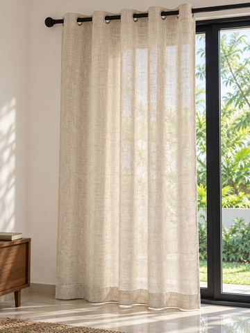 Natural flax open weave semi sheer eyelet curtain panel hung beside sliding glass patio door