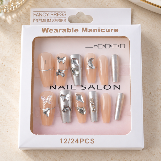 Fancy Press metallic silver chrome and nude coffin press-on nails with 3D silver butterflies and crystal jewels
