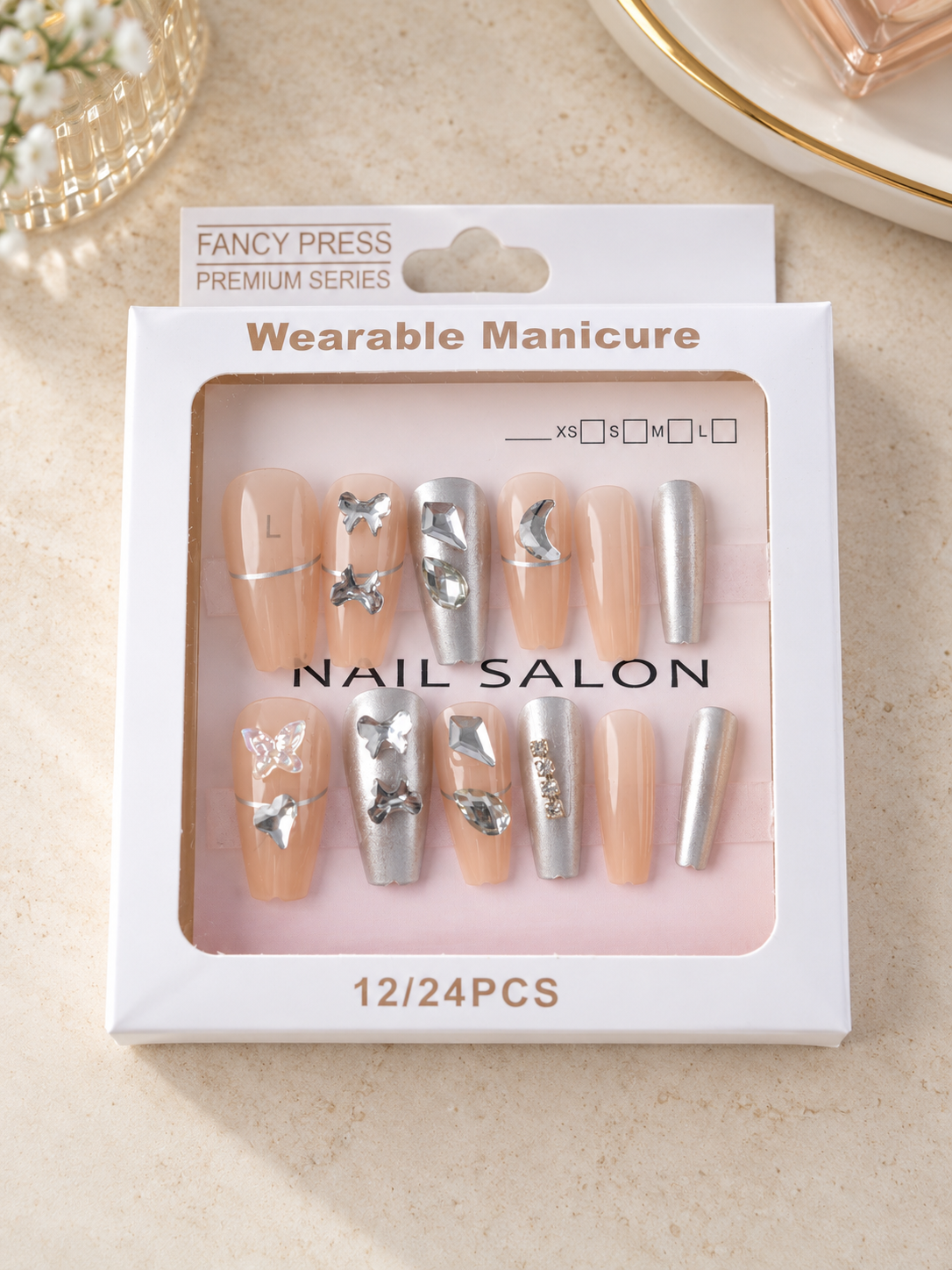 Fancy Press metallic silver chrome and nude coffin press-on nails with 3D silver butterflies and crystal jewels