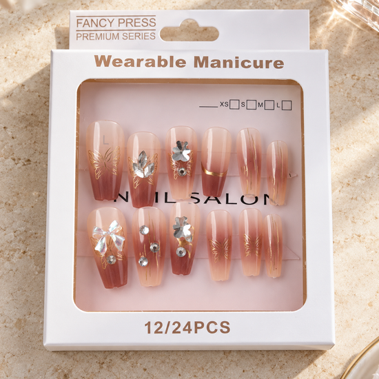 Fancy Press terracotta mocha ombre ballerina press-on nails with gold butterfly art and 3D ribbon bow charm