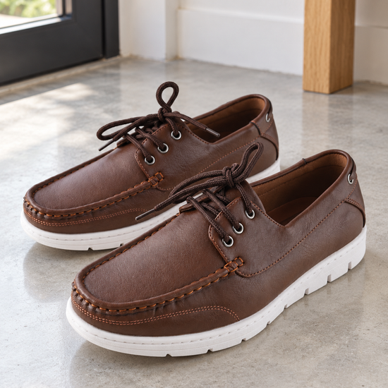Men's classic brown faux leather lace-up boat shoes with 360-degree lacing, silver rustproof eyelets, and contrasting white rubber grip sole