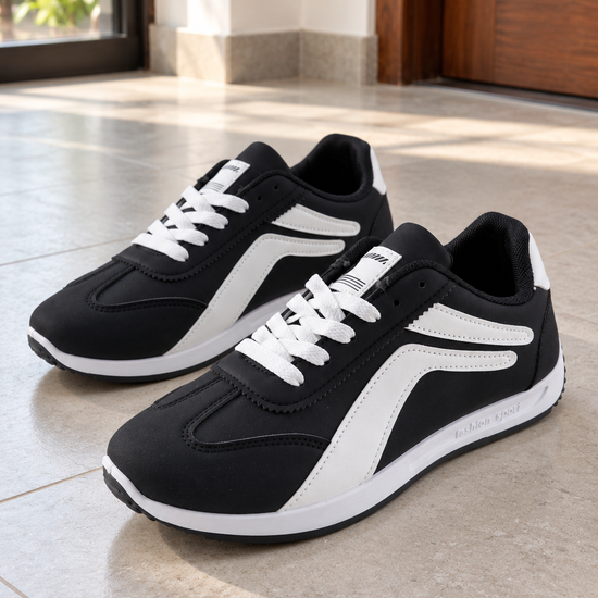 Men's black and white low-top fashion sport casual sneakers with white curved side stripes, white laces, and lightweight white foam sole