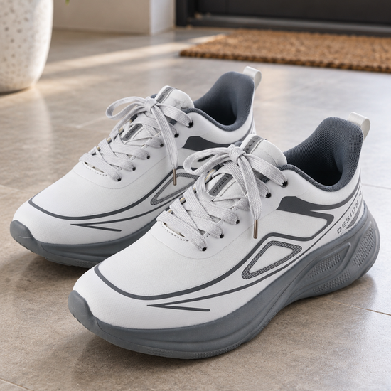 Men's white and slate grey lightweight athletic running sneakers with thick sculpted grey foam sole, geometric side overlays, and charcoal collar lining