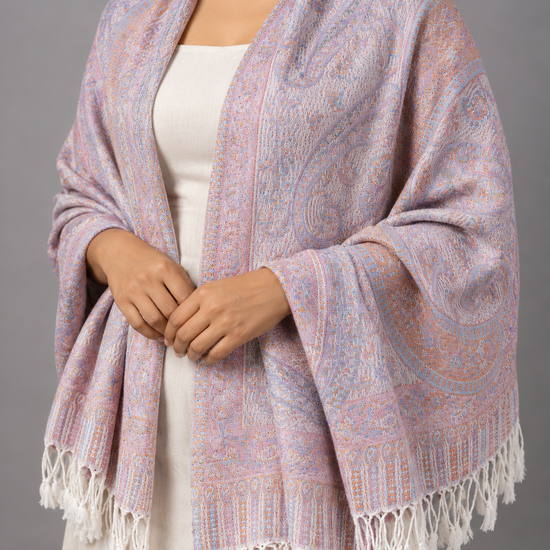 Women's pastel multi-tone jacquard pashmina shawl blending soft lilac lavender, blush pink, and sky blue with floral paisley motifs and white twisted fringe hem