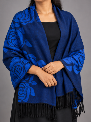 Women's royal sapphire blue and black reversible jacquard woven pashmina shawl featuring oversized stylized floral rose bouquets and knotted black tassel fringe