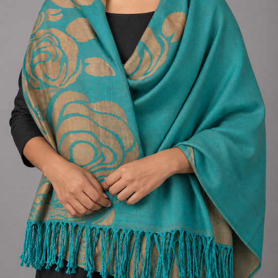 Women's teal turquoise and metallic antique gold reversible jacquard pashmina wrap showcasing stylized rose blooms, botanical vines, and matching teal fringe