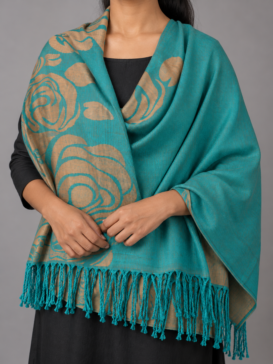 Women's teal turquoise and metallic antique gold reversible jacquard pashmina wrap showcasing stylized rose blooms, botanical vines, and matching teal fringe