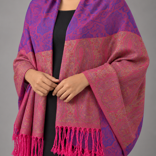 Women's two-tone magenta pink and royal purple jacquard pashmina wrap featuring antique gold paisley boteh border panel and vibrant magenta fringe tassels