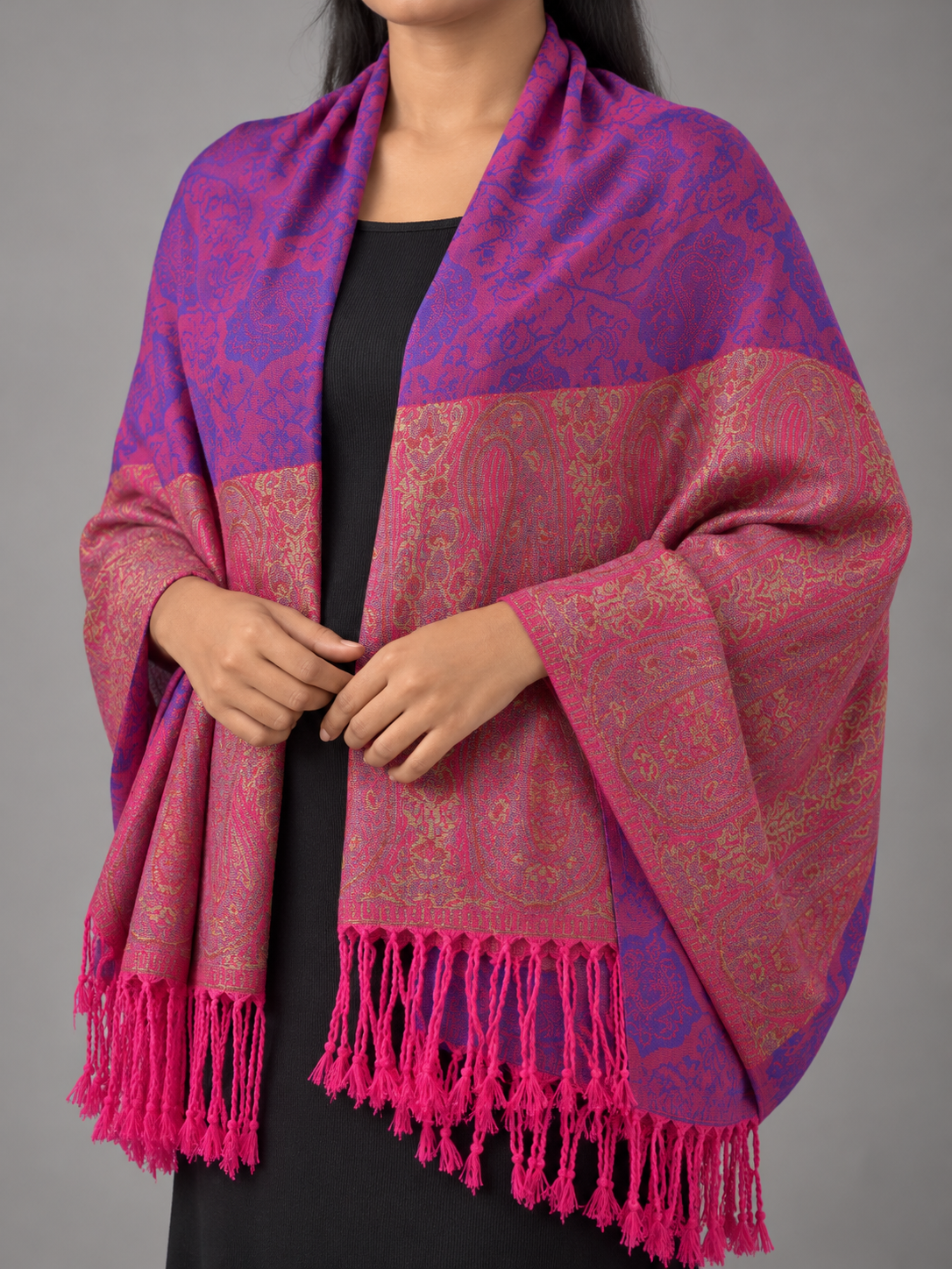 Women's two-tone magenta pink and royal purple jacquard pashmina wrap featuring antique gold paisley boteh border panel and vibrant magenta fringe tassels