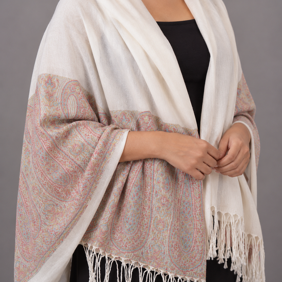 Women's ivory cream cashmere-feel pashmina wrap featuring soft pastel coral and powder blue floral paisley border with delicate white twisted fringe hem