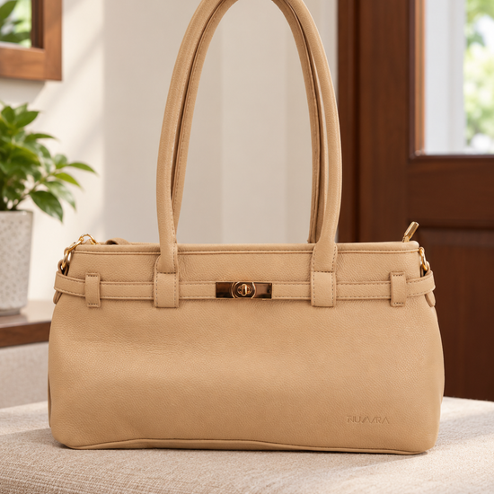Nuvaara women's structured warm beige grained vegan leather shoulder bag featuring long shoulder straps, gold turn-lock front accent, and top zipper closure