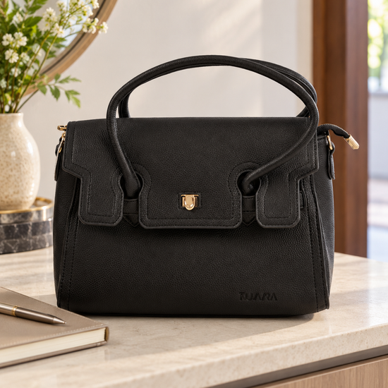 Nuvaara women's structured black grained vegan leather top-handle satchel handbag featuring front flap closure with gold-tone twist clasp and contoured dual handles