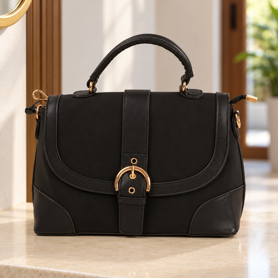 Nuvaara women's structured black vegan leather shoulder satchel bag featuring curved flap with gold-tone horseshoe buckle and arched top handle