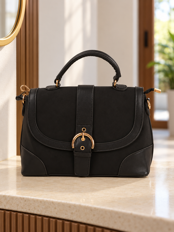 Nuvaara women's structured black vegan leather shoulder satchel bag featuring curved flap with gold-tone horseshoe buckle and arched top handle
