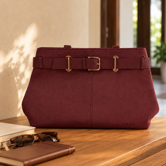 Nuvaara women's belted wine red textured vegan leather shoulder tote bag featuring front belt detail with polished gold buckle and tall shoulder handles